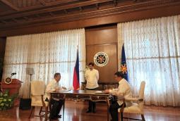 Pres. Marcos Jr quietly witnessed Energy Sec. Raphael Lotilla (left) and BARMM environment and energy minister Akmad Brahim sign the contracts in Malacanang.  